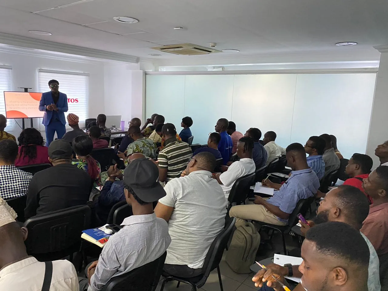 In-person market education seminar with seated participants